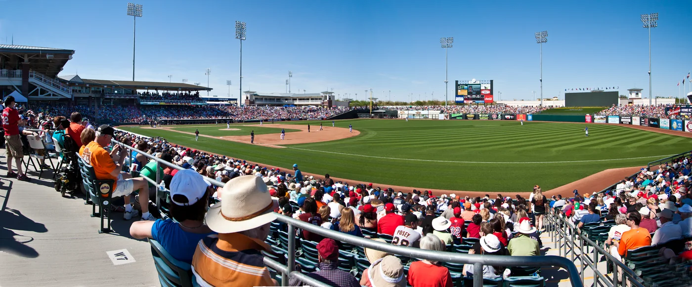 Fans seated around the baseball diamond at Surprise Stadium in Arizona.