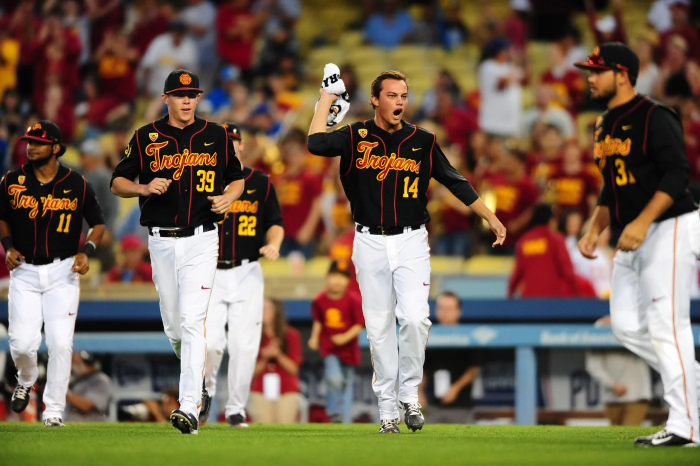 USC baseball players gathered on the field during a 2015 matchup with UCLA at Dodger Stadium.